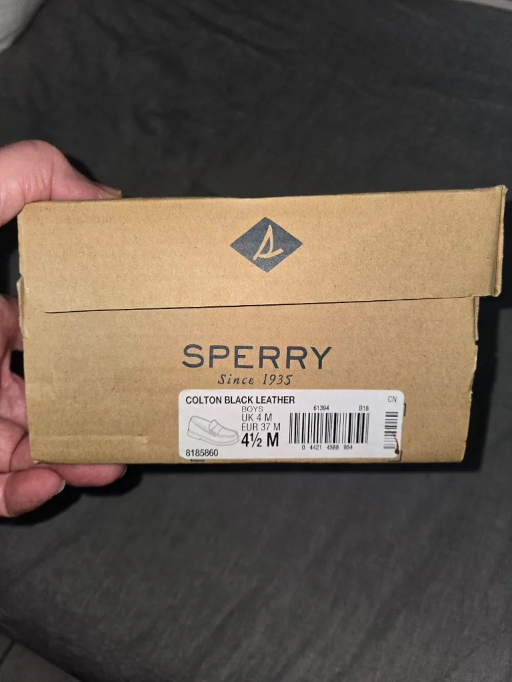 Brand new Sperry Colton Black Leather Penny Loafers in Boys Size 4.5 Medium.